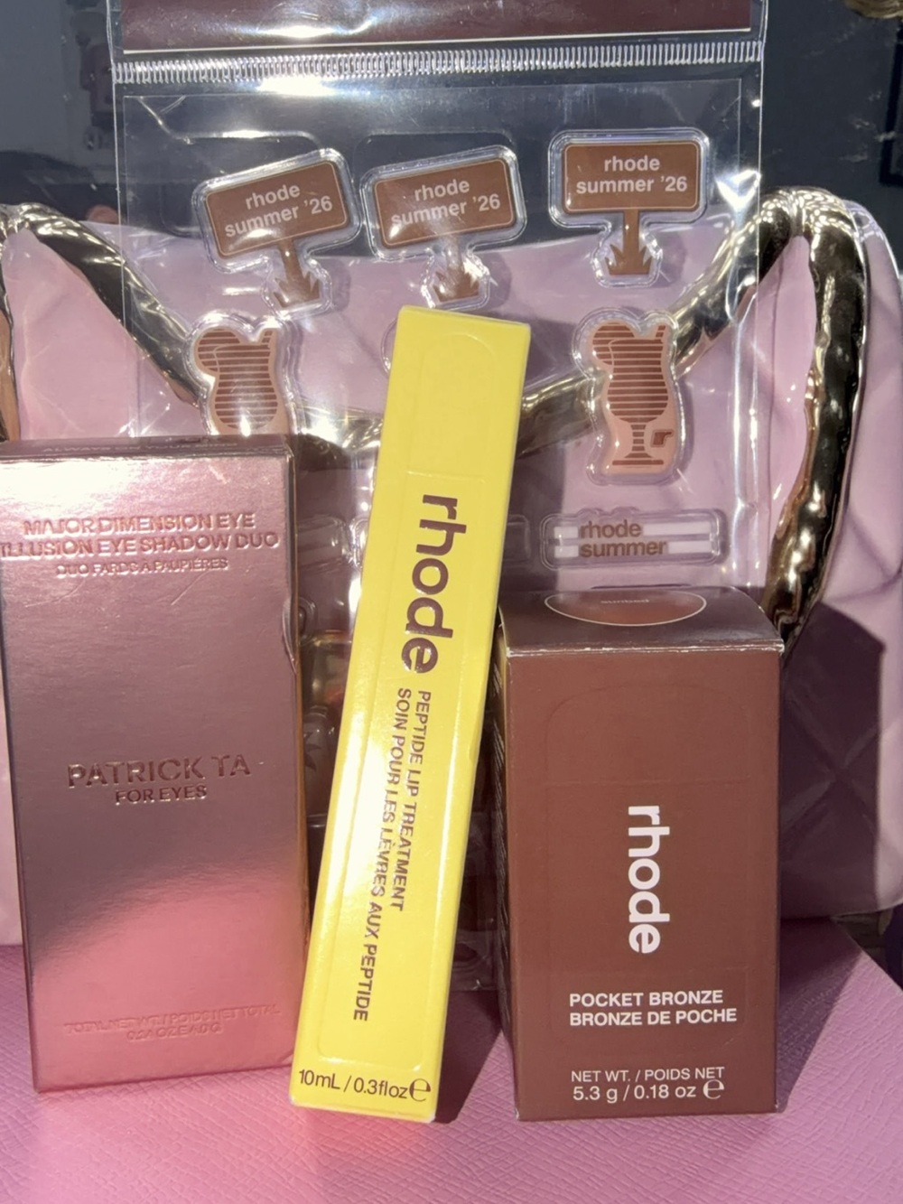 RHODE gift set with pink packaging, yellow lip treatment & brown bronze